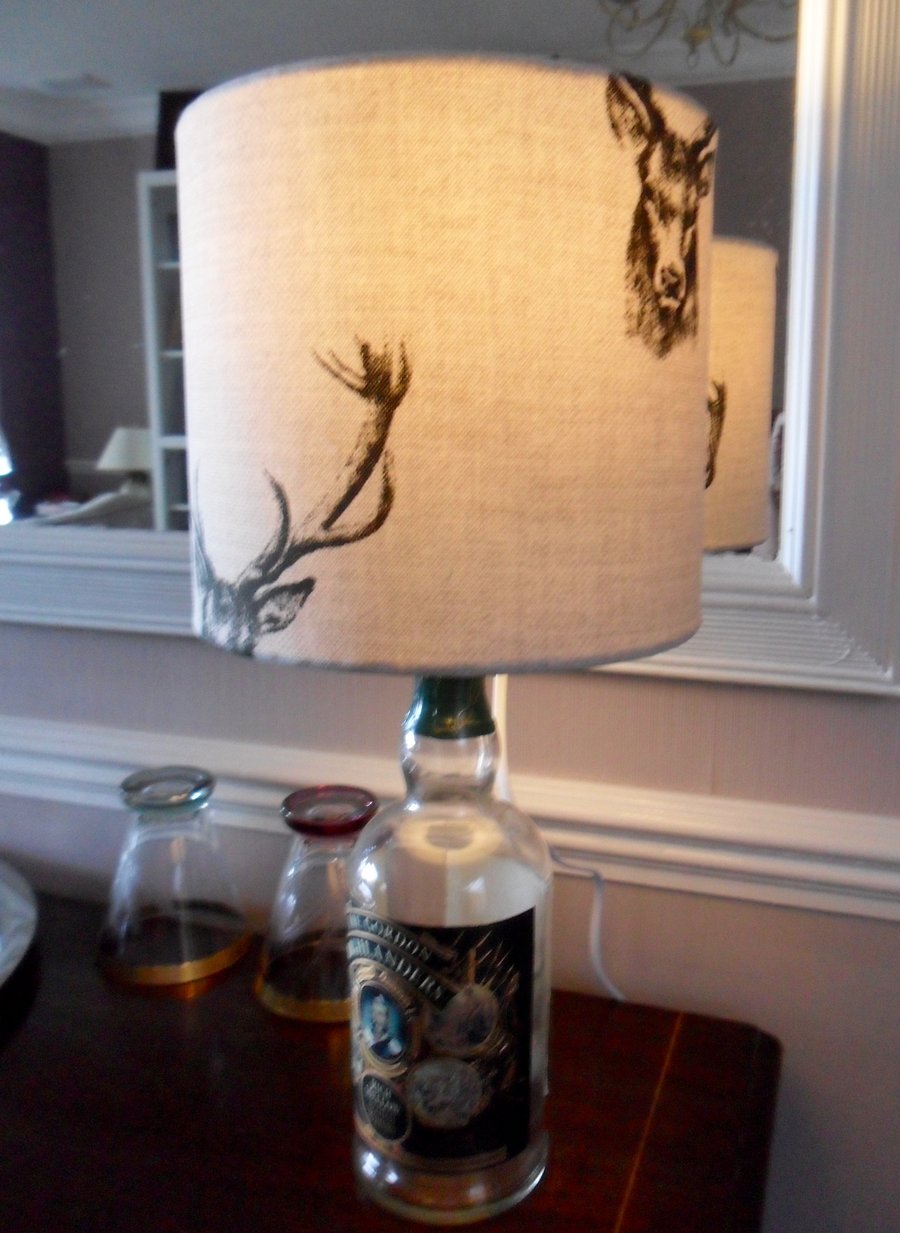 Up-cycled whisky bottle lamp with a handmade lampshade in a stag design