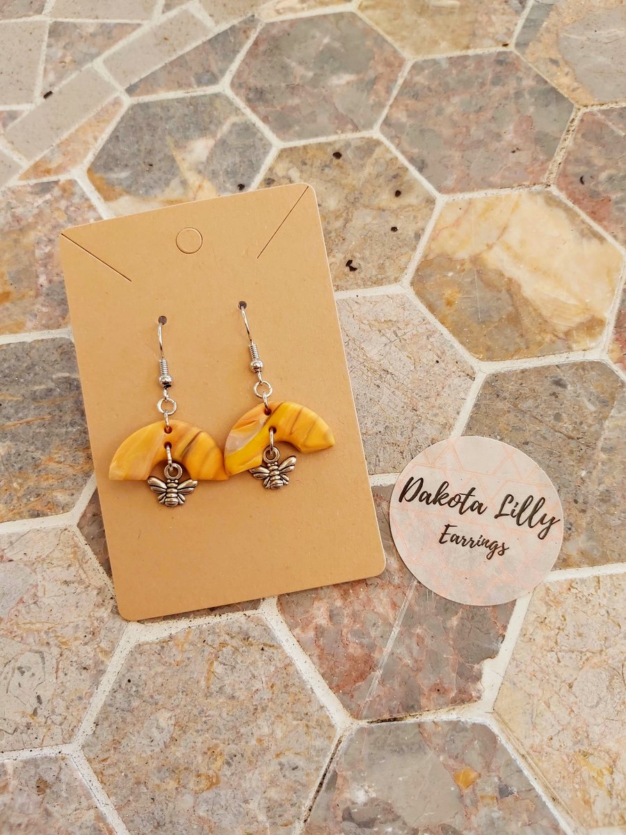 Honey polymer clay arc shaped earrings with bee charm