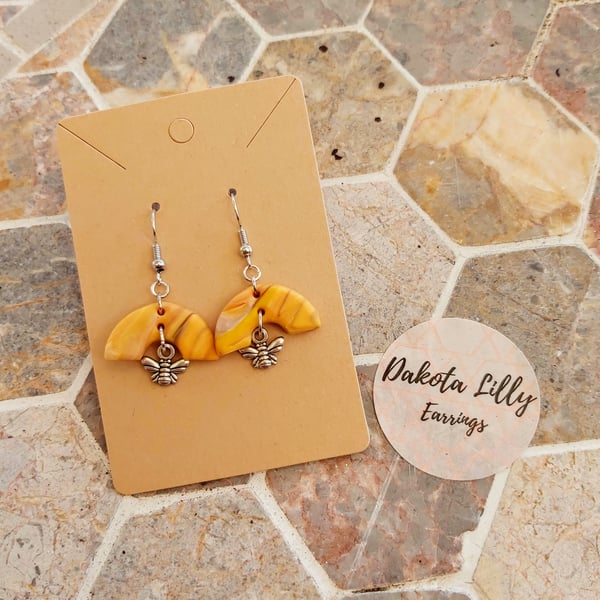 Honey polymer clay arc shaped earrings with bee charm