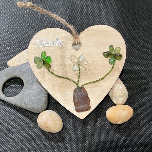 Wooden heart with 'thanks' sentiment  with sea glass flowers.