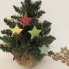 Set of five little handmade ceramic star decorations