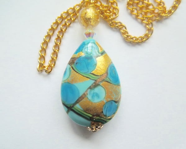 Murano glass blue and gold pear drop pendant with Swarovski and gold chain.