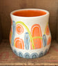Ceramic hand thrown pot with unique orange and blue decoration - Image 2