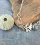 Silver sea urchin and seaweed pendant