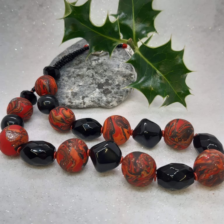 Necklace in  orange, red and black sparkle 