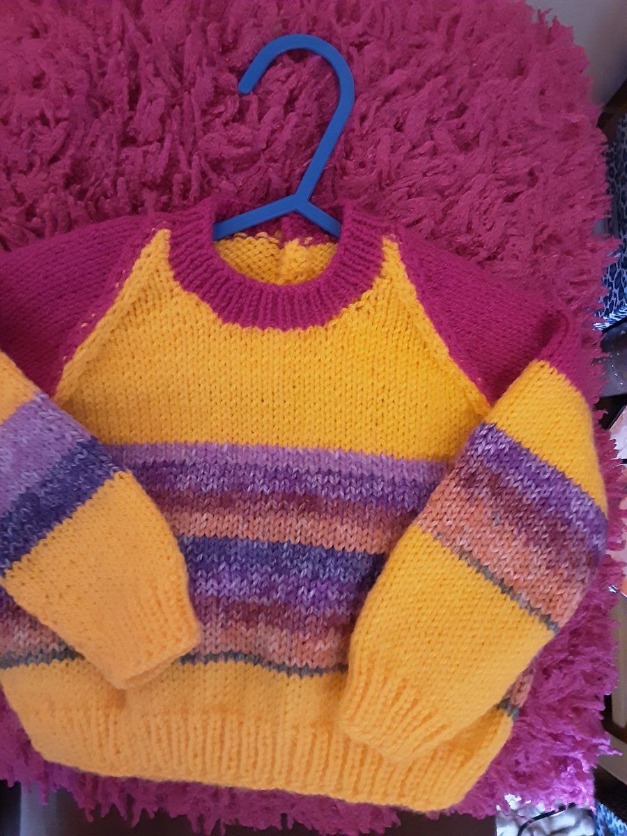Bright yellow and pink handmade baby jumper