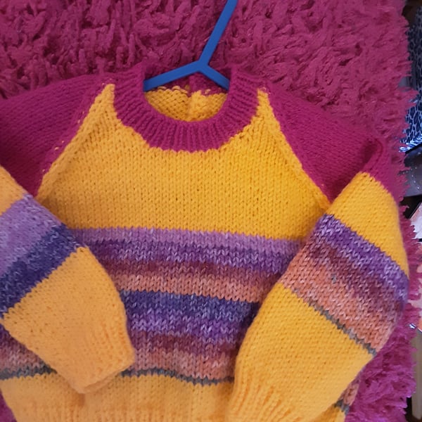 Bright yellow and pink handmade baby jumper