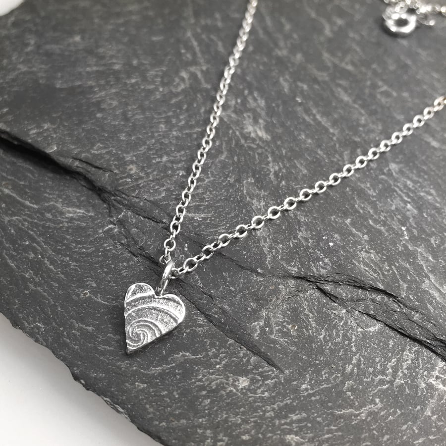Tiny silver heart pendant on 18 inch chain