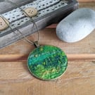 Felted pendant - greens, hint of yellow in a bronze bezel