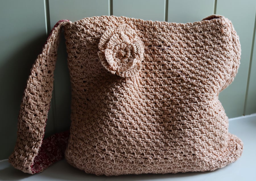 Crochet caramel coloured shoulder bag with flower decoration