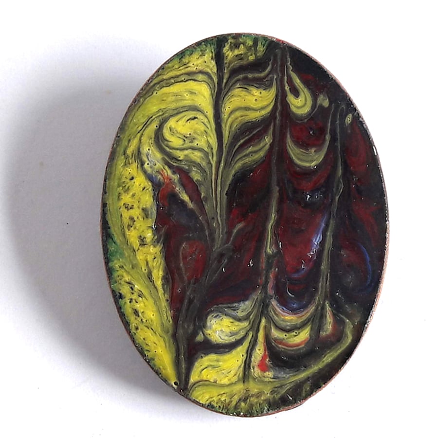yellow and maroon scrolled brooch