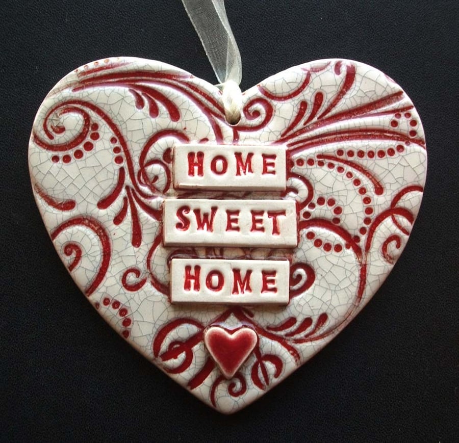 Red ceramic heart decoration Home Sweet Home.