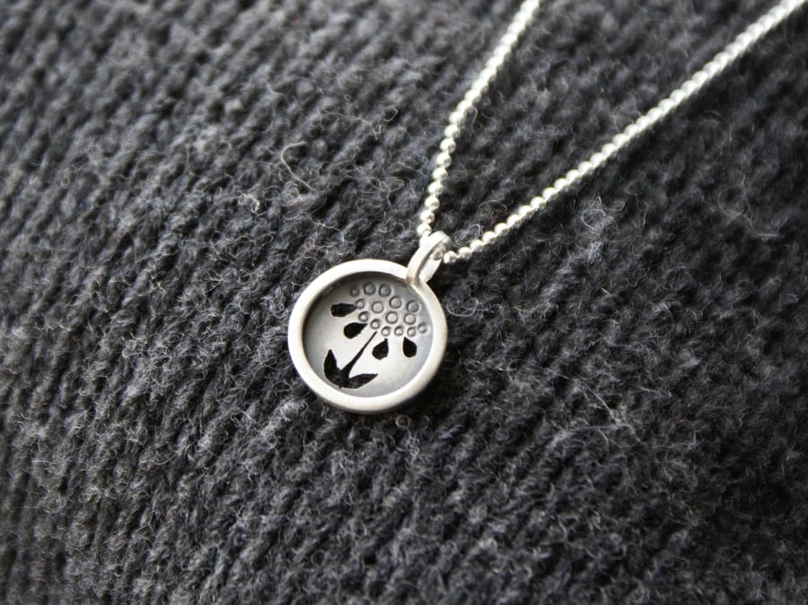 Tiny silver flower pendant 
