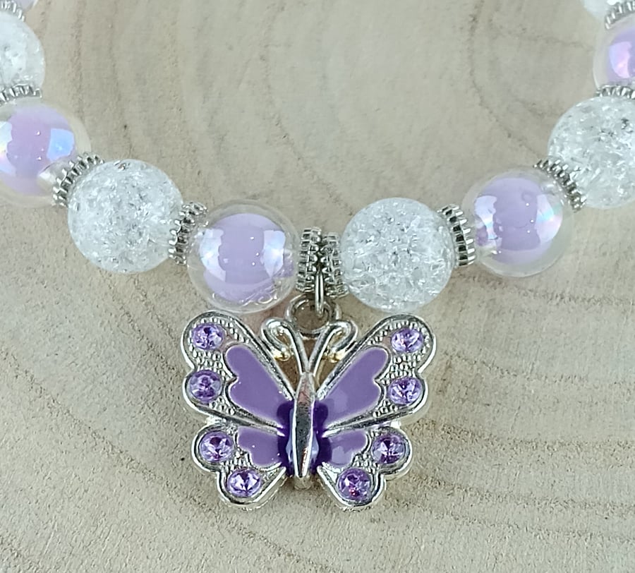 Bracelet - Lilac and clear beaded bracelet with a lilac  butterfly charm