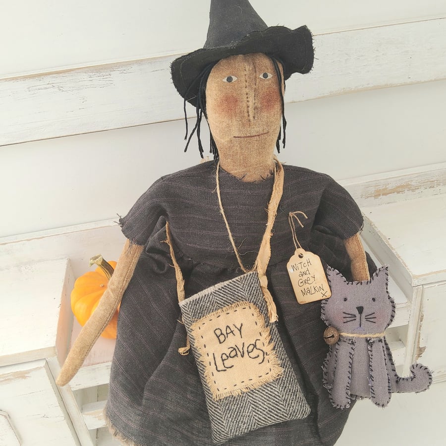 Primitive witch with cat