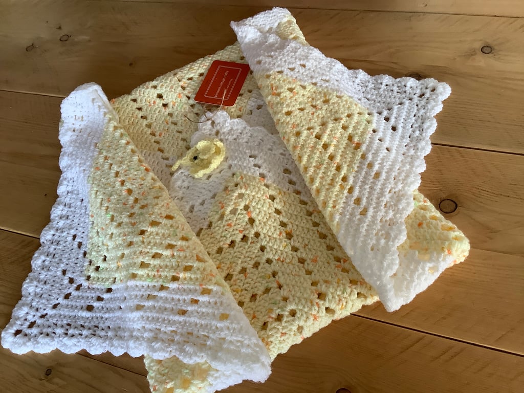 Crocheted baby blanket in fresh lemon and white with a sprinkle of sparkle