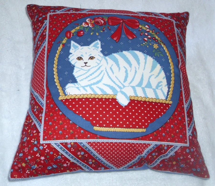 A lovely stylised blue tabby cat in a basket cushion 