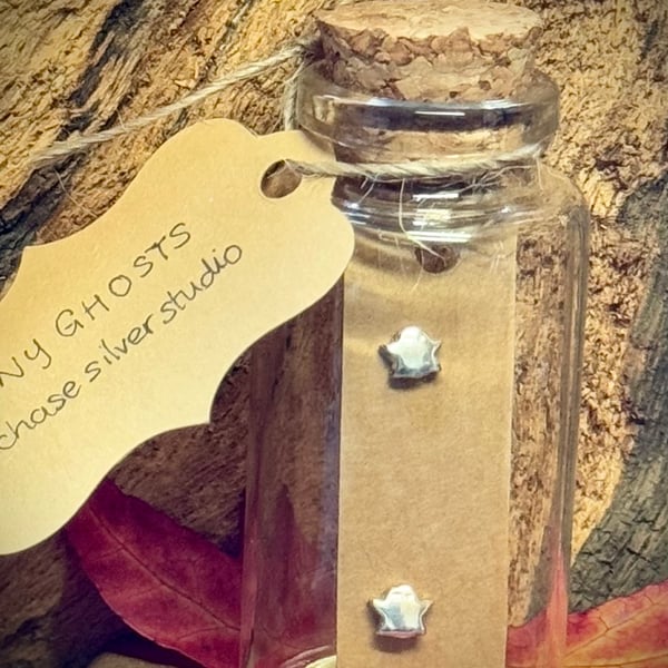 Tiny little silver ghost earrings 