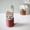 Wooden House on a Vintage Bobbin with Clay Tree