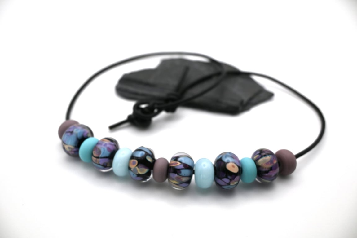 black, blue and purple lampwork glass leather cord necklace
