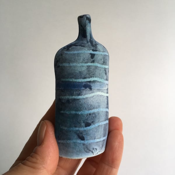 Tracks Bottle Slip Decorated onto Stoneware Ceramic