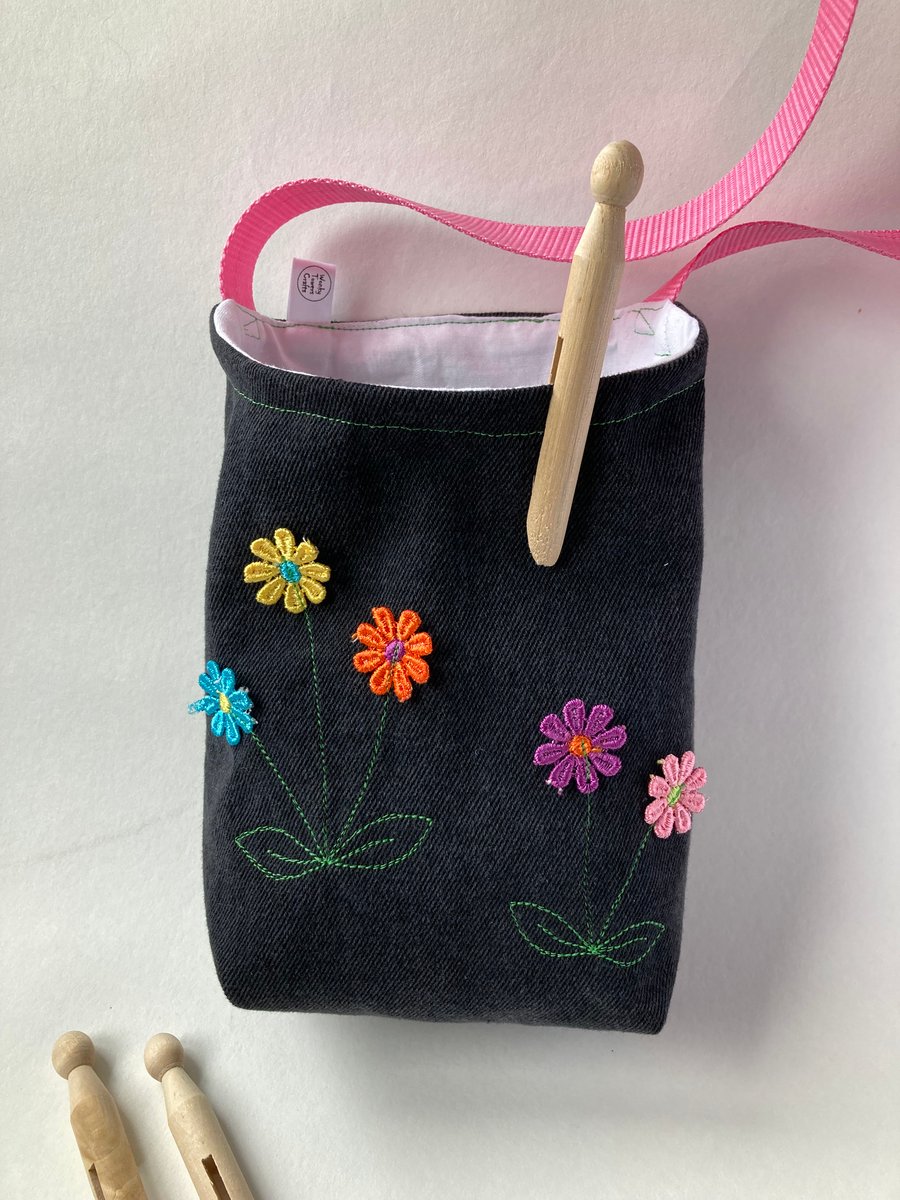 Cross-body peg bag. Repurposed denim with floral decoration