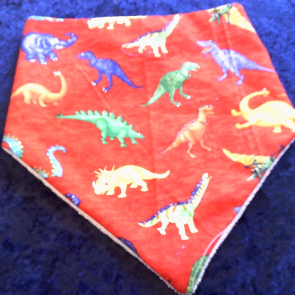 Brightly Coloured Dinosaurs on Red Dribble Bib