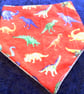 Brightly Coloured Dinosaurs on Red Dribble Bib - Image 1