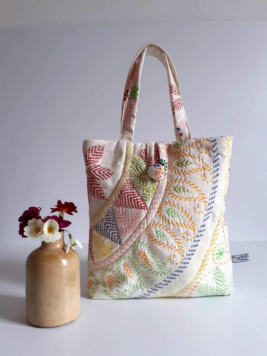 Little bucket bag padded in upcycled machined embroidery in a Folk art style