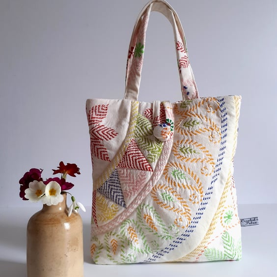 Little bucket bag padded in upcycled machined embroidery in a Folk art style