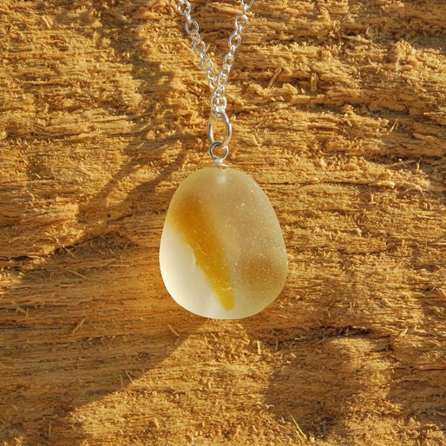 Sea glass pendant with yellow stripe