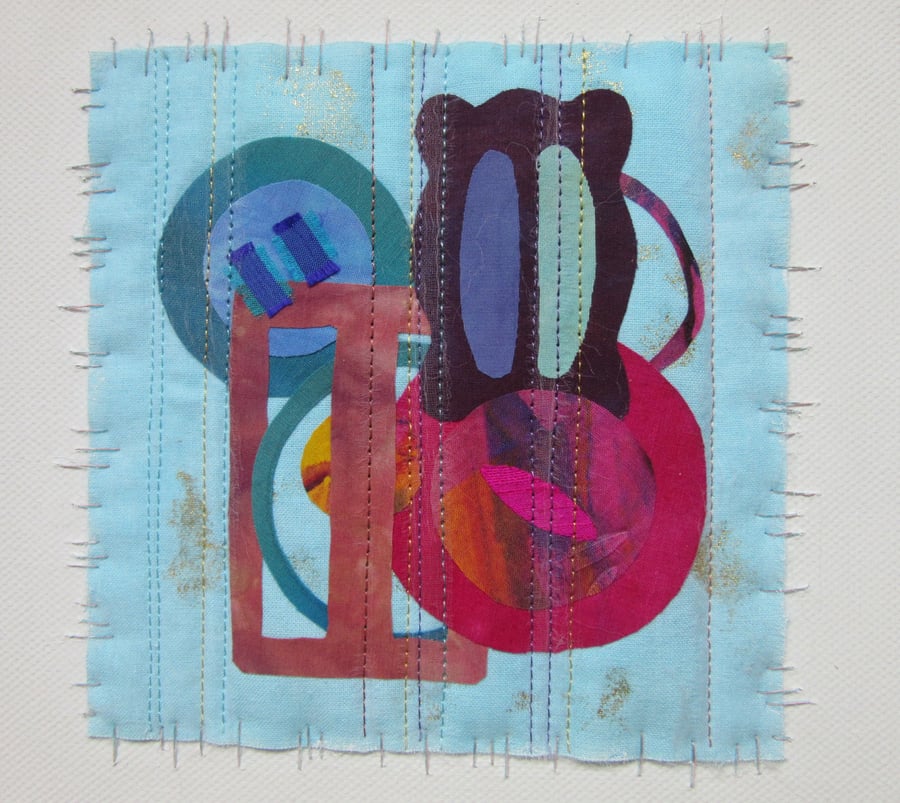 FABRIC COLLAGE PICTURE. Buckles and buttons art textile on canvas