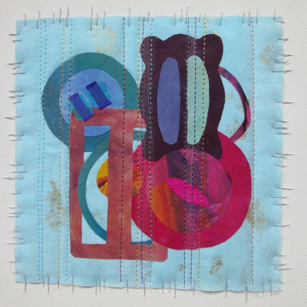 FABRIC COLLAGE PICTURE. Buckles and buttons art textile on canvas