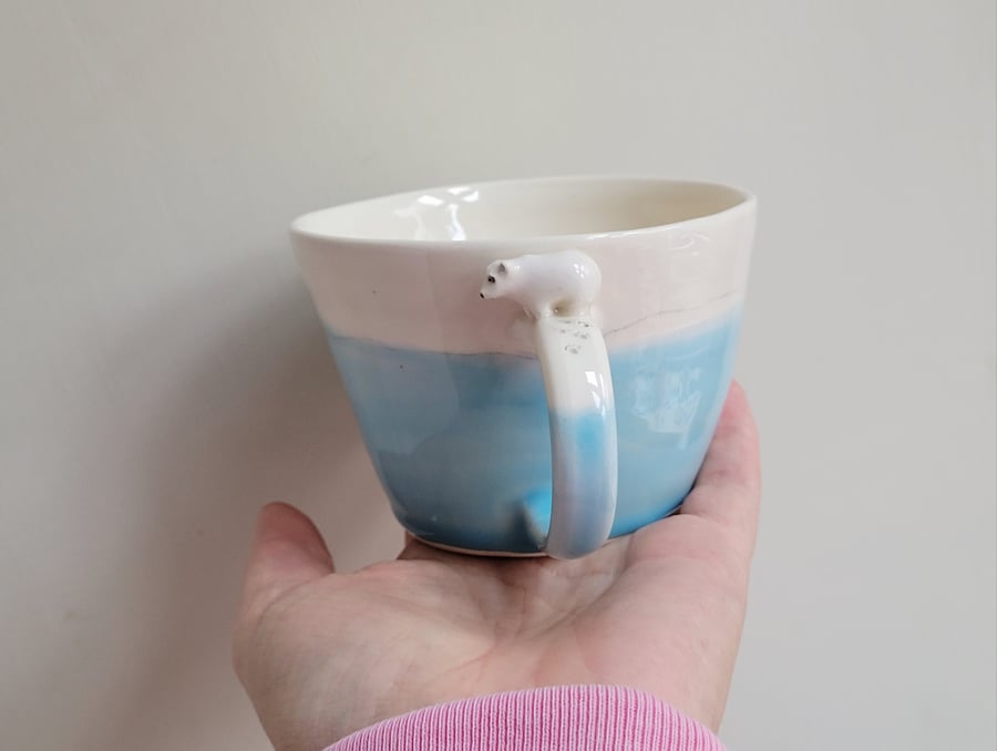Blue handmade ceramic polar bear cup with tiny bear & pawprints