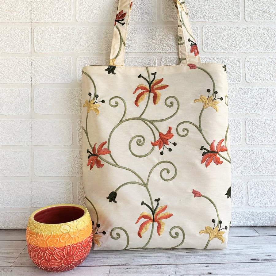 Floral tote bag in embroidered floral fabric with orange and yellow lilies