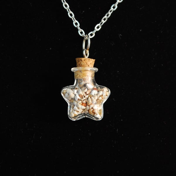 Star shaped bottle of tiny shells pendant
