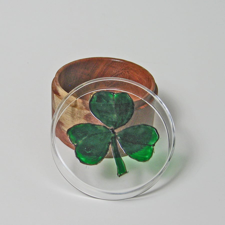 A glass and wood trinket pot