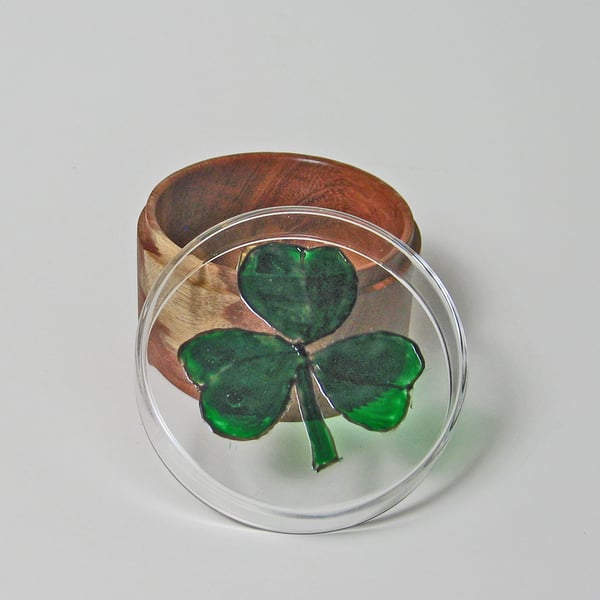 A glass and wood trinket pot