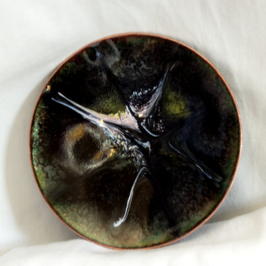 enamelled dish: scrolled white gold and pink on black over clear