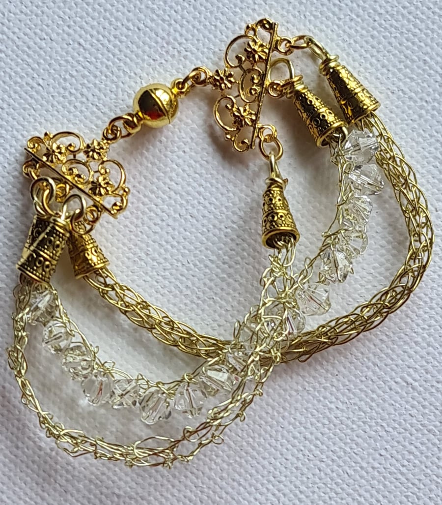Gold crystal three stranded bracelet