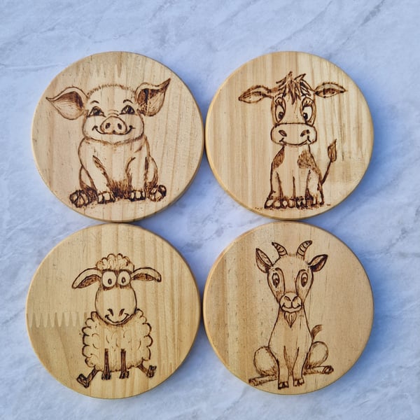 Burned wood coasters with farm animal theme