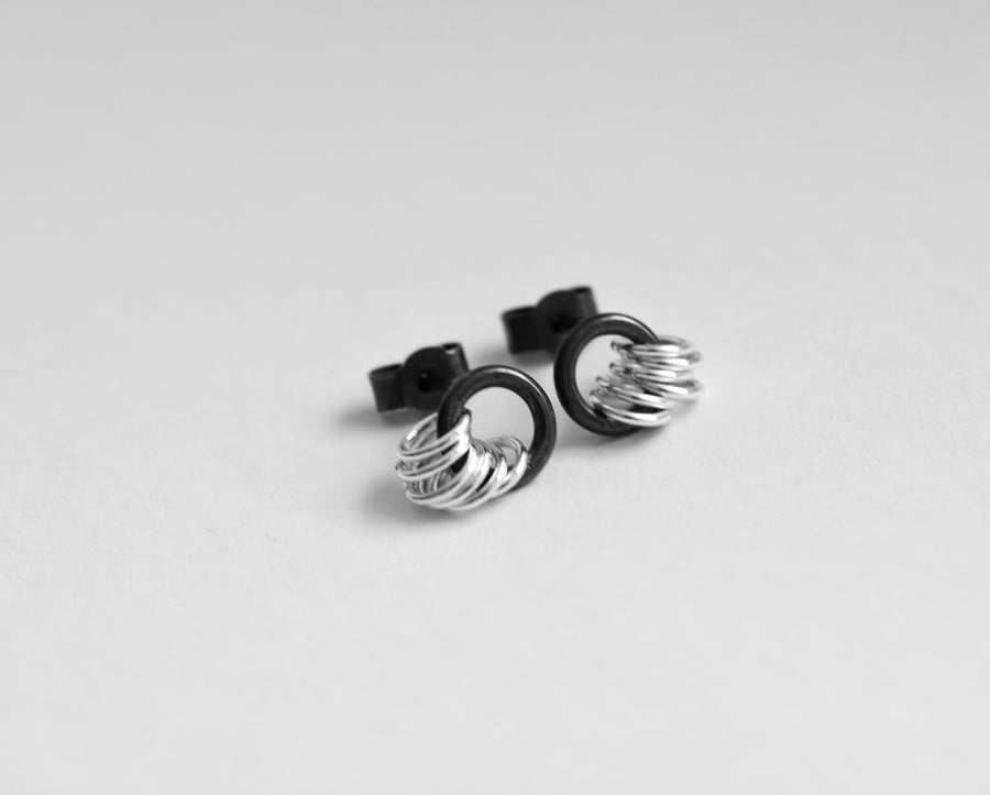 Sterling silver circle stud earrings, partially oxidised.