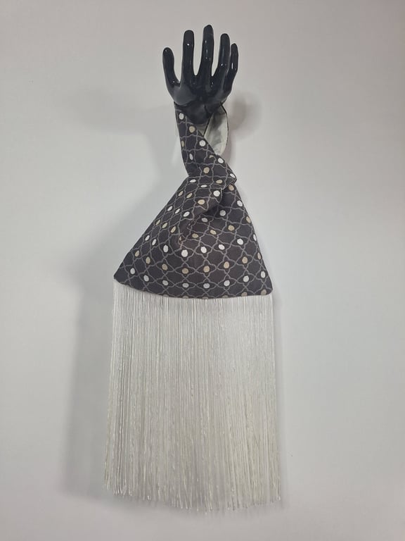 Brown and beige geometric patterned Japanese Knot bag with 28cm tassel trim