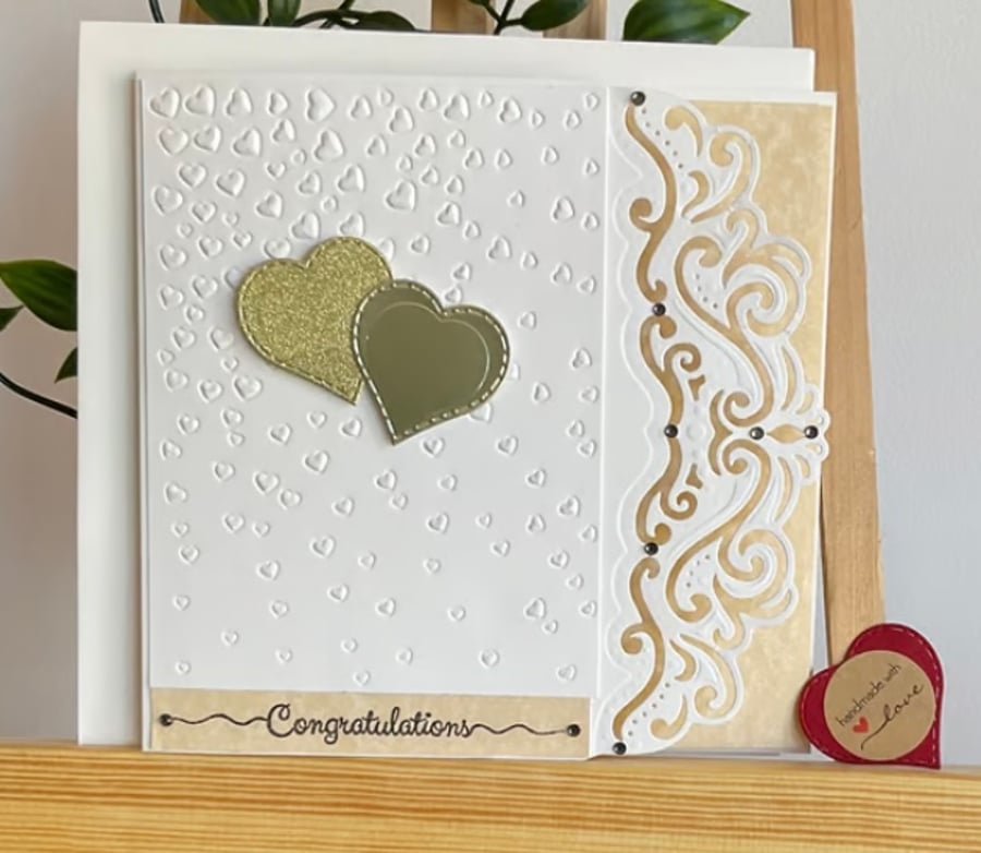 Cards. Card for a wedding with gold hearts 