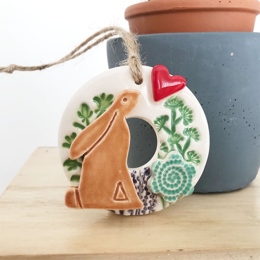 Small ceramic hare decoration with summer flowers blue