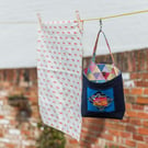 Peg bag with a foxy patchwork block detail to the front and colourful lining