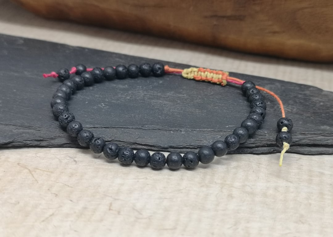 Men's black lava bead bracelet with adjustable hemp cord