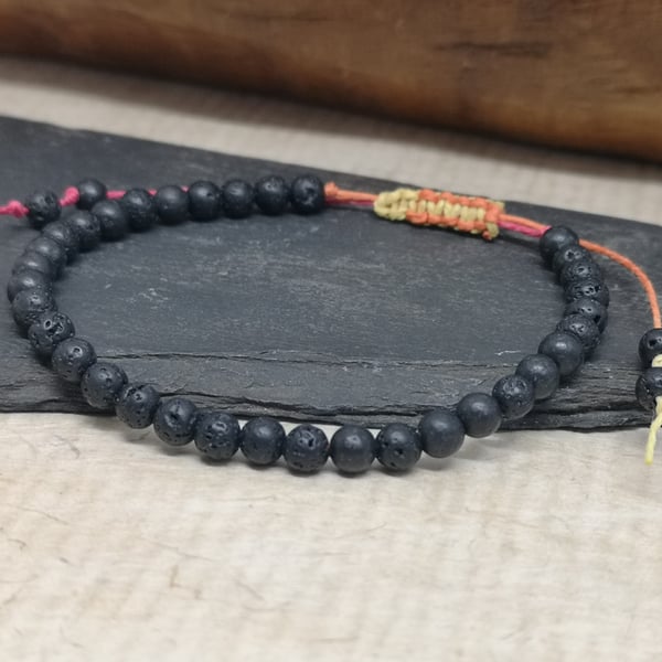 Men's black lava bead bracelet with adjustable hemp cord