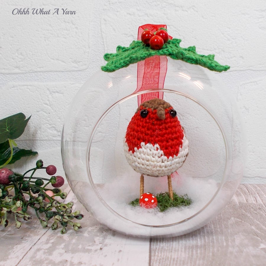 Crochet robin in a glass bauble. Christmas decoration.  Hanging decoration.