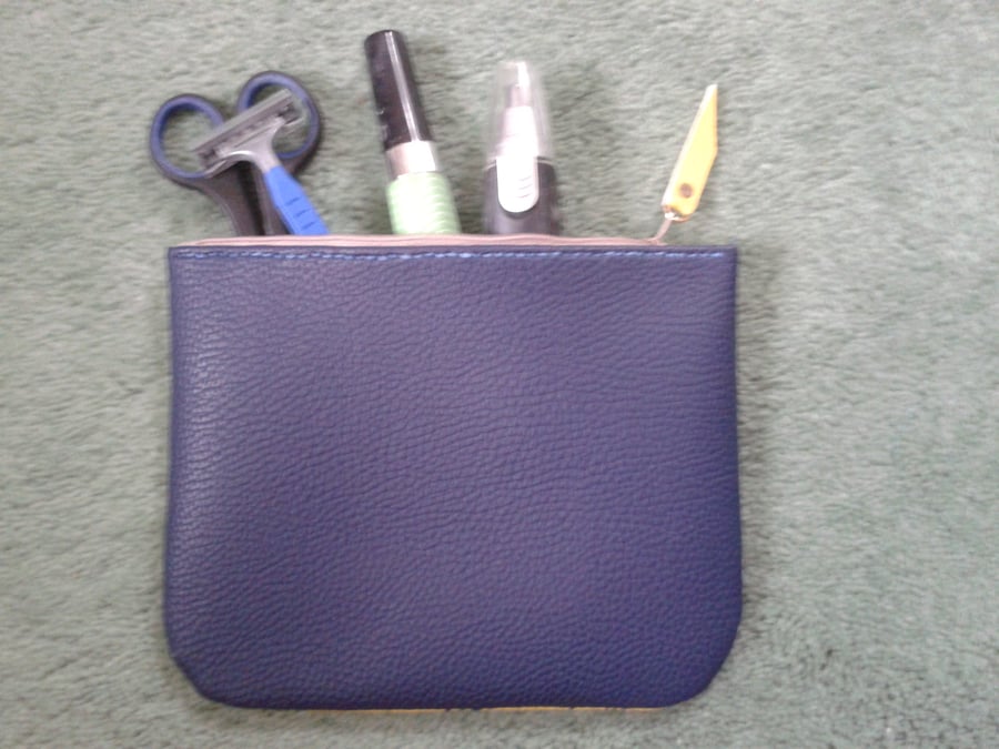 blue and yellow faux leather midi stash bag